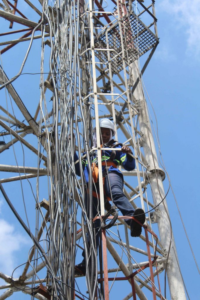 Network Engineer doing maintenance on radio tower